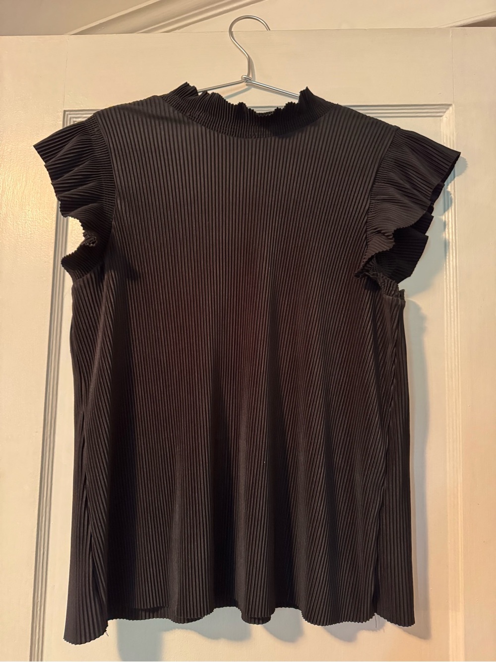 Silky black blouse, pleats and ruffles